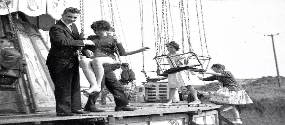 Young people on funfair swings